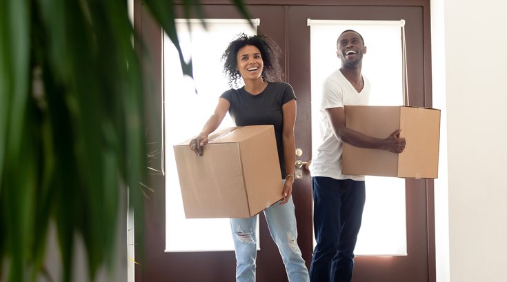Purchased - Excited black couple impressed entering new home together