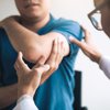 Physical therapists are checking patients elbows at the clinic office roo