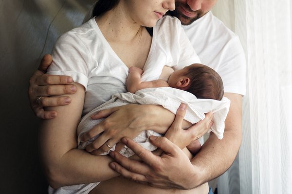 Father and mother with a newborn son.