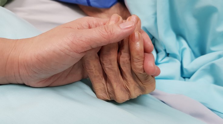 Purchased - Holding elderly person's hand