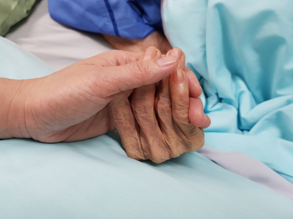 Purchased - Holding elderly person's hand