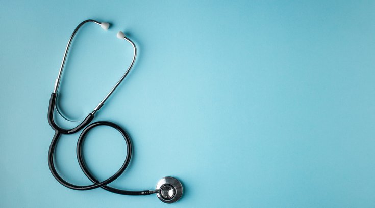 Doctors instrument on blue background