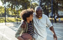 Purchased - Grandfather playing basketball with his grandson