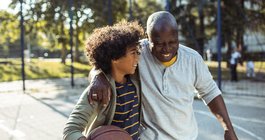 Purchased - Grandfather playing basketball with his grandson