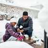 Purchased - father and daughter playing in the snow in the backyard