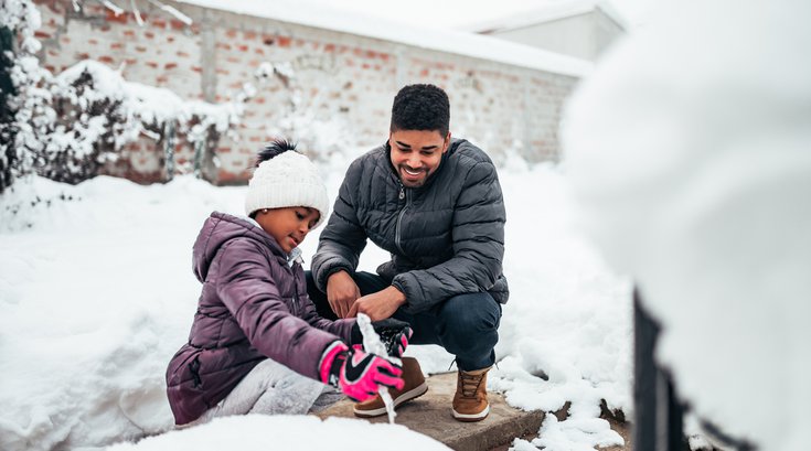 Purchased - father and daughter playing in the snow in the backyard