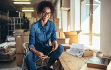 Limited - Woman sitting in commercial workspace