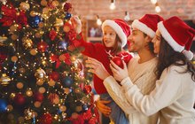 Happy family decorating xmas tree