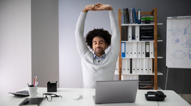 Businessman Stretching His Arms stock photo