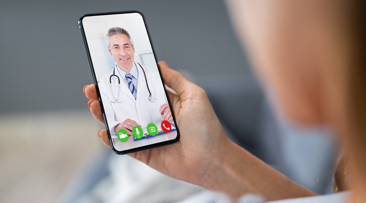 Person video chatting with doctor