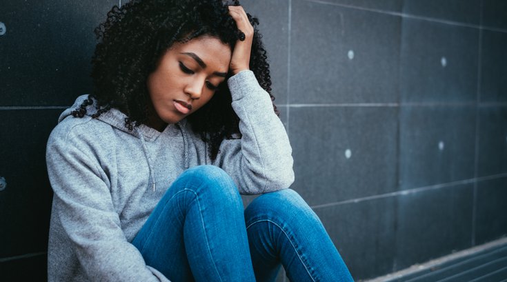 Purchased - Sad and lonely girl sitting