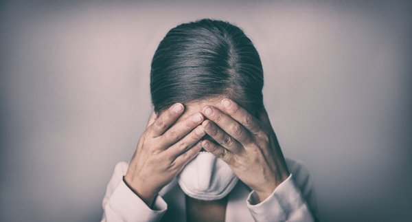 Purchased - woman crying covering face mask with hands