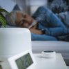 Purchased - Woman sleeping next to a humidifier