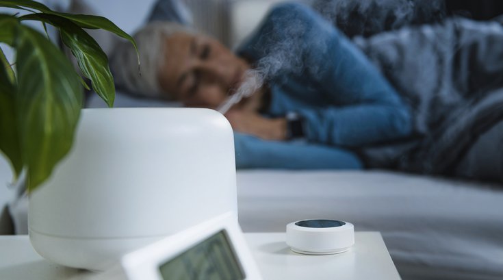 Purchased - Woman sleeping next to a humidifier