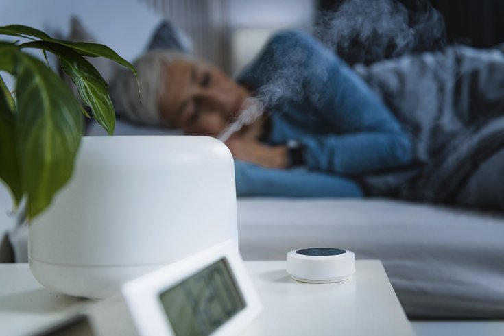 Purchased - Woman sleeping next to a humidifier