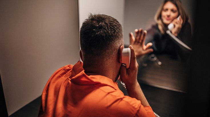 Purchased - An incarcerated person talking to a loved one on the phone