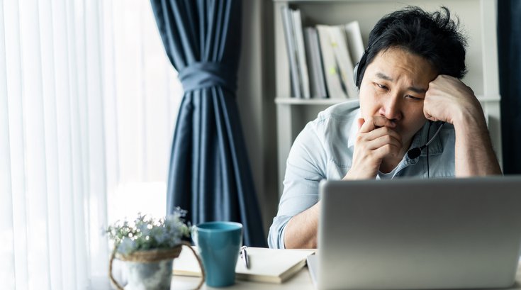 Purchased - man feeling tired, bored and sleepy while working