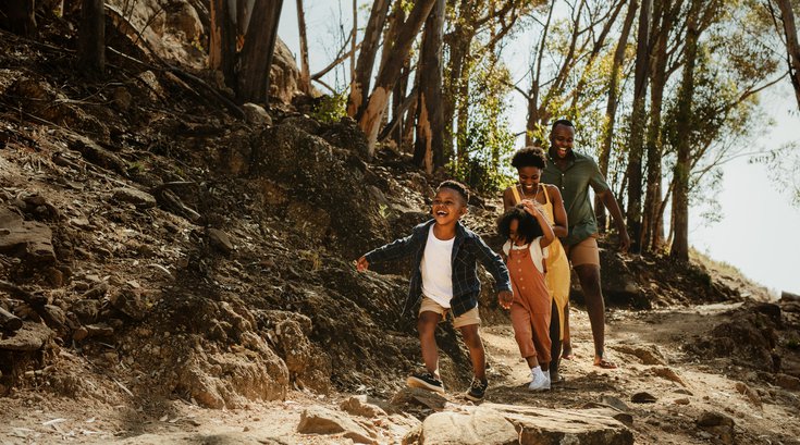 Purchased - Family running down rocky trail