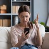 Purchased -Woman looking angrily at her phone