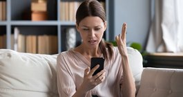 Purchased -Woman looking angrily at her phone