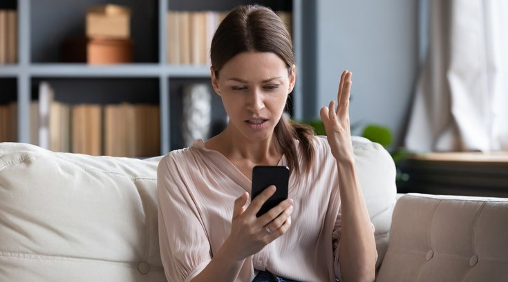 Purchased -Woman looking angrily at her phone