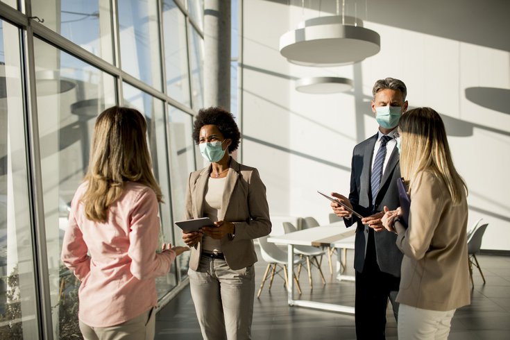 Purchased - People working in an office with masks