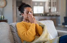 Limited - Sick woman blowing her nose not feeling well