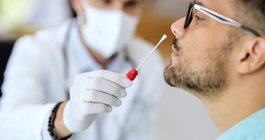 Purchased - Close-up of a man having PCR test at medical clinic