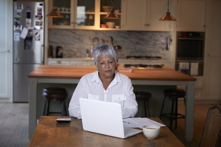 Limited - Senior citizen sitting on the computer