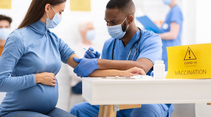 Purchased - Woman Receiving Coronavirus Vaccine Injection Shot In Hospital