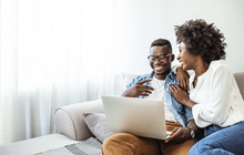 Purchased - Couple reviewing health plans on the sofa