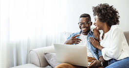 Purchased - Couple reviewing health plans on the sofa