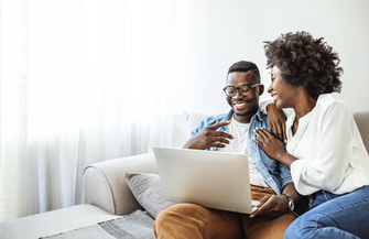 Purchased - Couple reviewing health plans on the sofa