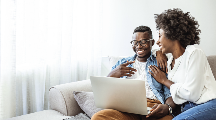 Purchased - Couple reviewing health plans on the sofa