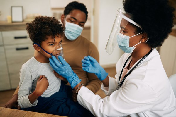 Purchased - boy receiving asthma treatment from doctor