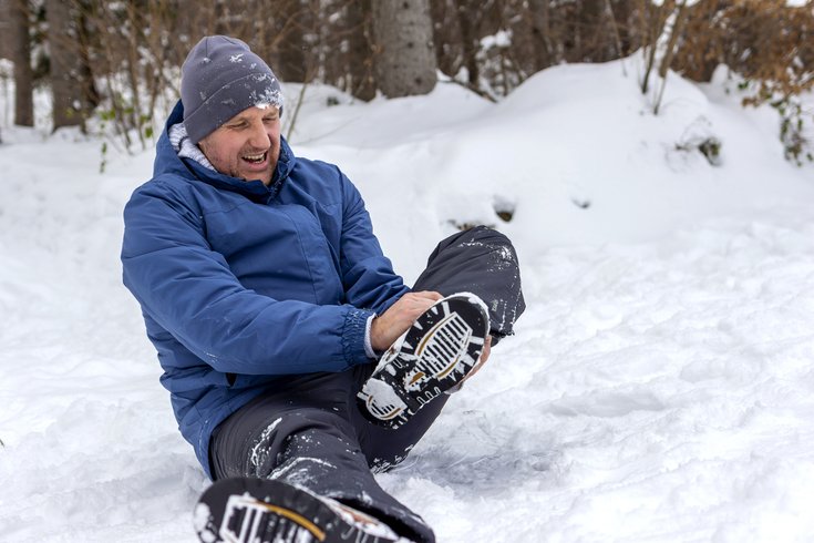 Purchased - Mature male feeling the pain of a strained muscle.