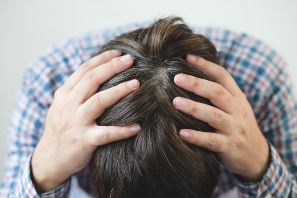 Purchased - Man with headache or brain fog