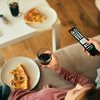 Purchased - Close-up of couple watching TV while eating pizza at home
