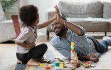 Purchased - Dad and son playing with construction toy