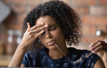 Purchased - Woman working with a headache