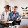 Mid adult couple working on home finance