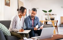 Mid adult couple working on home finance