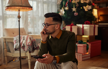 Purchased - Lonely man using phone at Christmastime