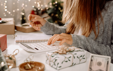 Purchased - Woman checking her holiday expenses