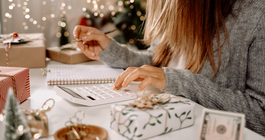 Purchased - Woman checking her holiday expenses