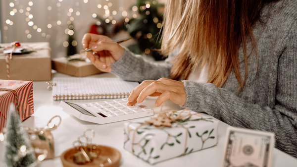 Purchased - Woman checking her holiday expenses