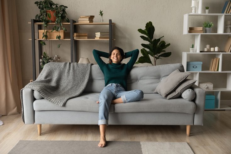 Purchased - Woman relaxing at home on the couch
