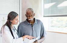 Purchased - Doctor speaking with a patient about his health care