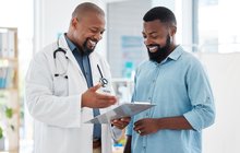 Purchased - Young patient in a consult with his doctor.