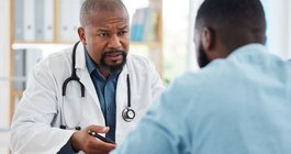 Purchased - Medical doctor talking to a patient about health